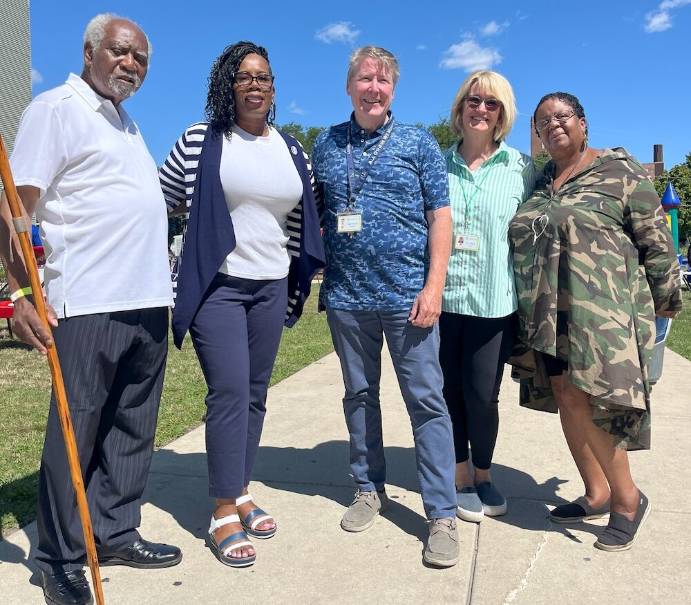 Congressman Danny Davis with community partners outside.