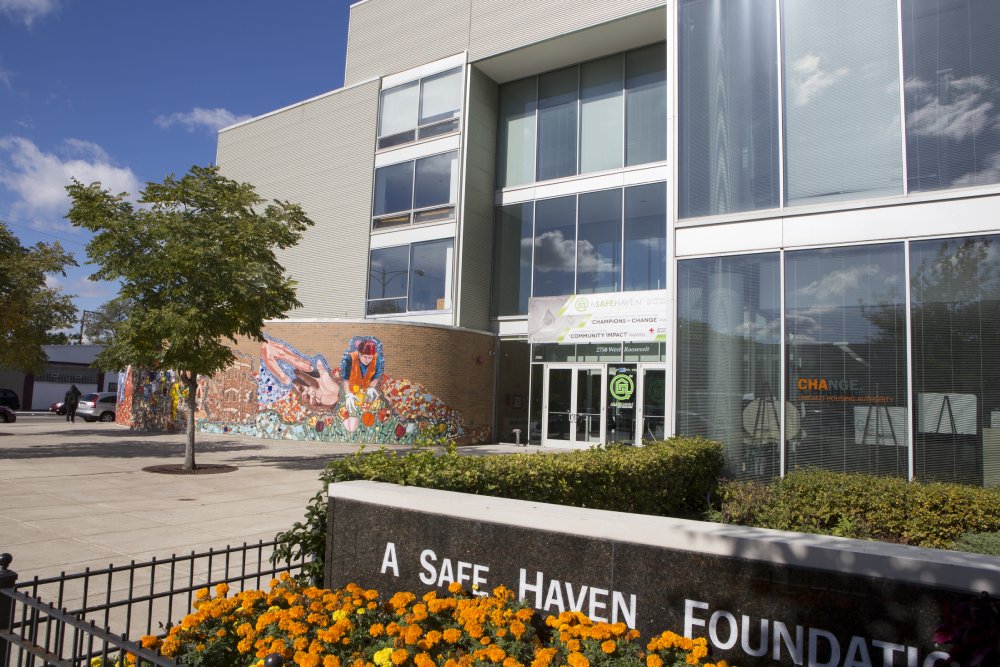 Front entrance of A Safe Haven Foundation with a vibrant mural and clear signage.